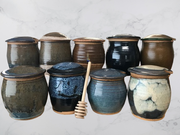 Handmade ceramic honey pots with honey dipper