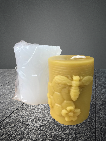 Pillar candle mold with bee, comb, and flowers