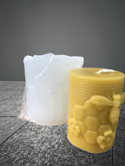 Pillar candle mold with bee, comb, and flowers