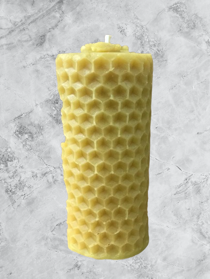 Pillar honeycomb candle with bee on top