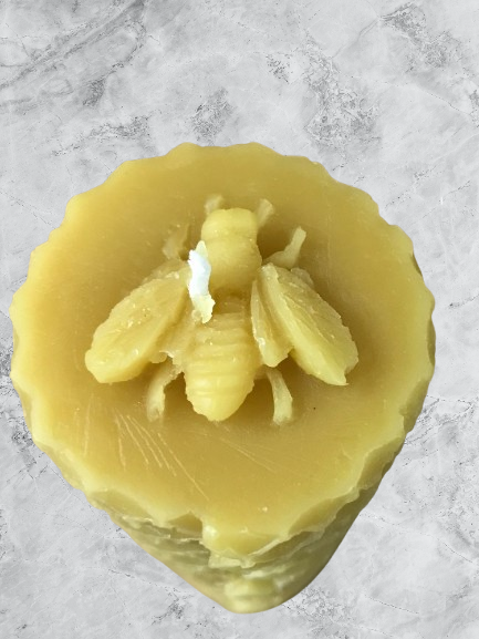 Pillar honeycomb candle with bee on top